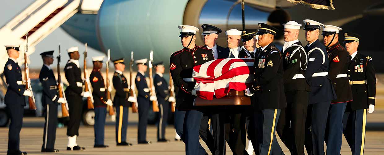 U.S. service members transfer the remains of former President George H.W. Bush on Joint Base Andrews, Maryland, Dec. 03, 2018. Military and civilian personnel assigned to Joint Task Force-National Capital Region provided ceremonial and civil affairs support during President George H.W. Bush's state funeral. (DoD photo by U.S. Army Pfc. Elijah Foster) George Bush Dignified Transfer at Andrews AFB