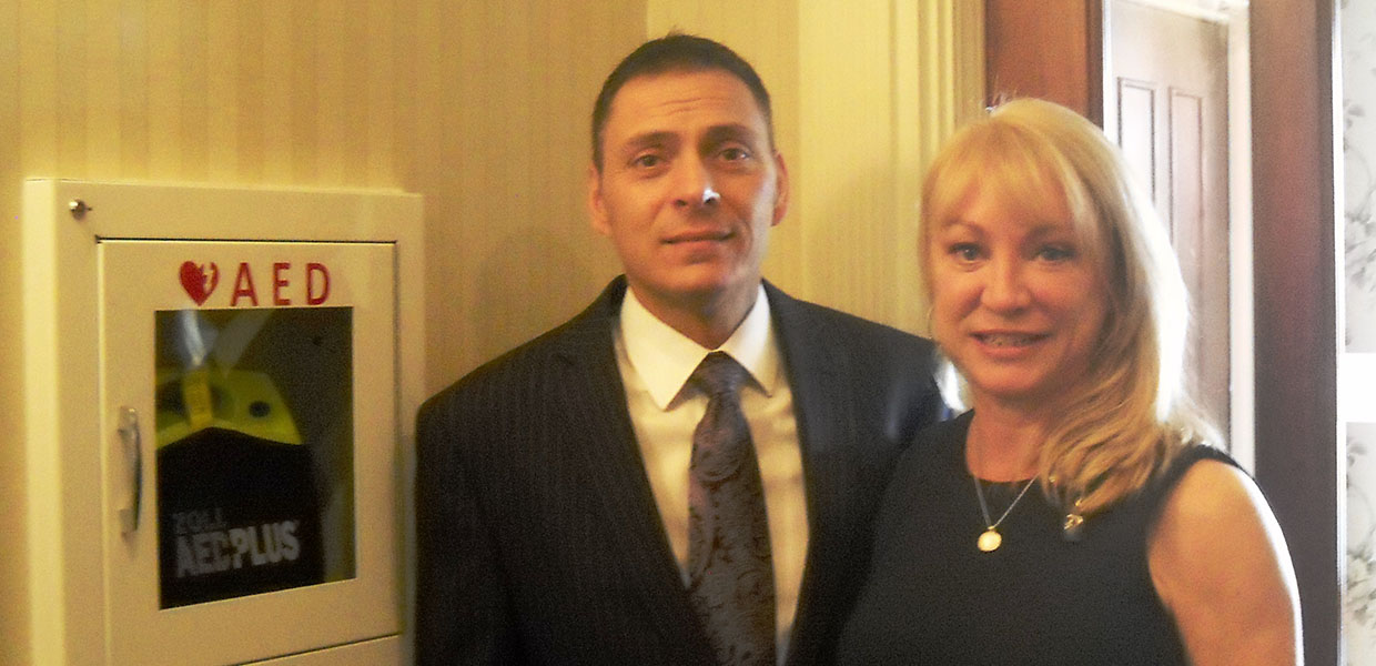 David Parente and Kristin McVeigh of the McVeigh Funeral Home in Albany, NY Funeral Directors David Parente and Kristin McVeigh with AED at McVeigh Funeral Home in Albany, NY